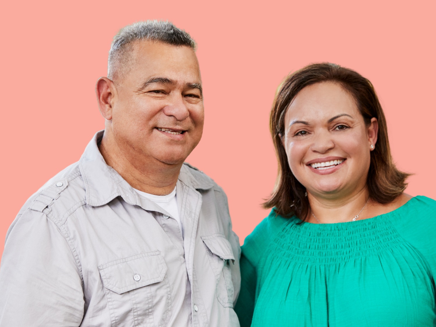A couple standing together, smiling
